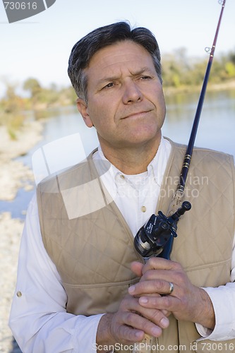 Image of Man With Fishing Pole