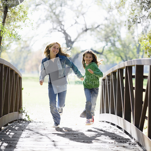 Image of Young Girls On Bridge