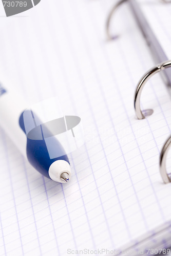 Image of organizer, notebook and pen