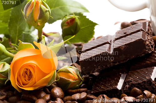 Image of chocolate, coffee, cinnamon and yellow flower