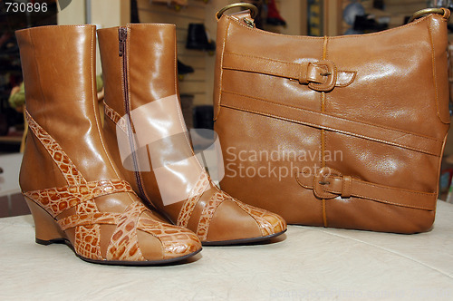 Image of boots and a handbag