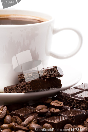 Image of cup of coffee, beans and black chocolate