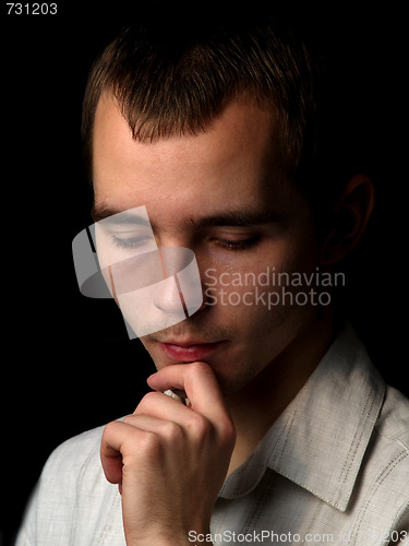 Image of Young man thinking