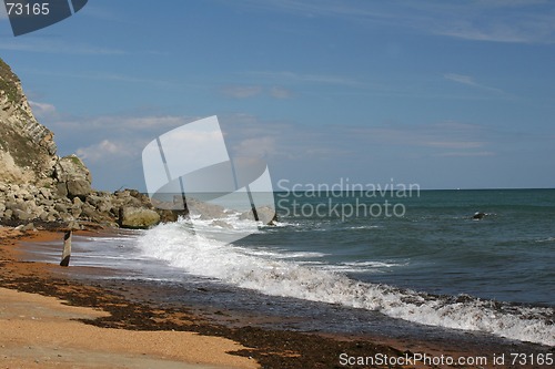 Image of Surf crashing on rocky beach