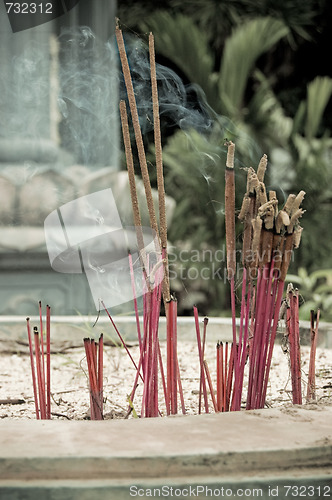 Image of Burning incense in urn at buddhist pagoda