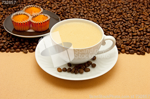 Image of White cup of coffee and coffee beans