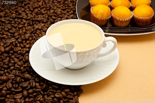 Image of White cup of coffee and coffee beans