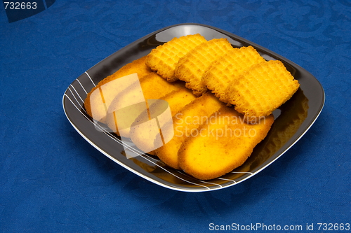 Image of cookies on a Plate on a blue background