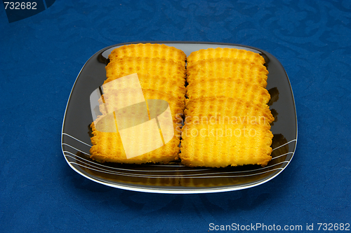 Image of cookies on a Plate on a blue background