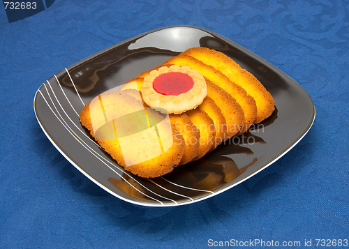 Image of cookies on a Plate on a blue background 