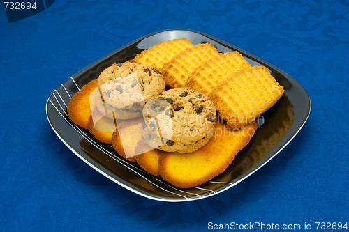 Image of cookies on a Plate on a blue background
