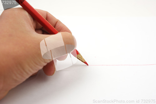 Image of red pencil writing