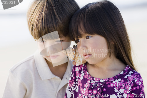 Image of Two Children With Shell