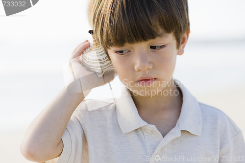 Image of Boy Holding Shell