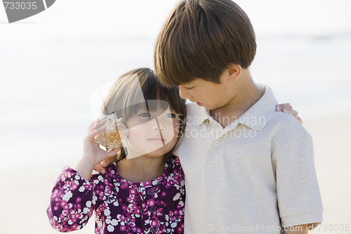 Image of Two Children With Shell