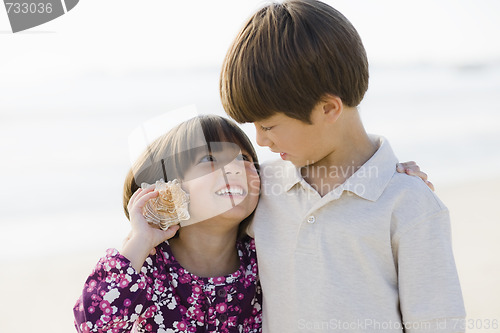 Image of Two Children With Shell