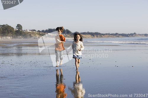 Image of Children Running on Beach