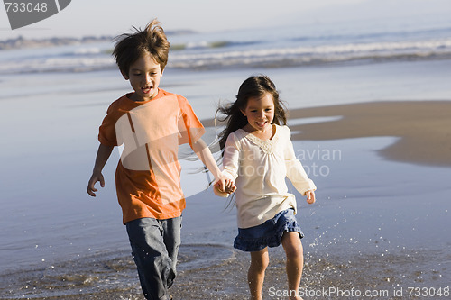 Image of Children Running on Beach