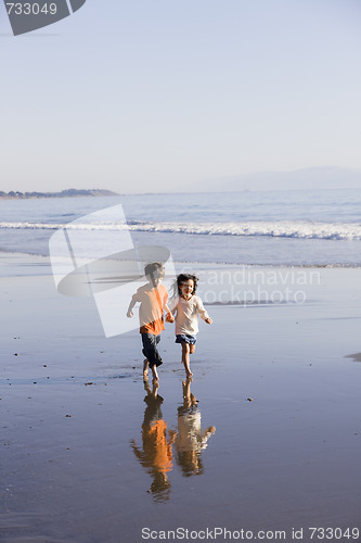 Image of Children Running on Beach