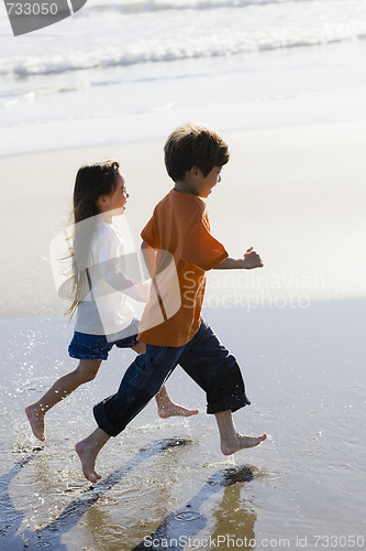 Image of Children Running on Beach