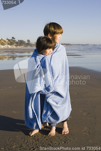 Image of Kids in Blanket at Beach