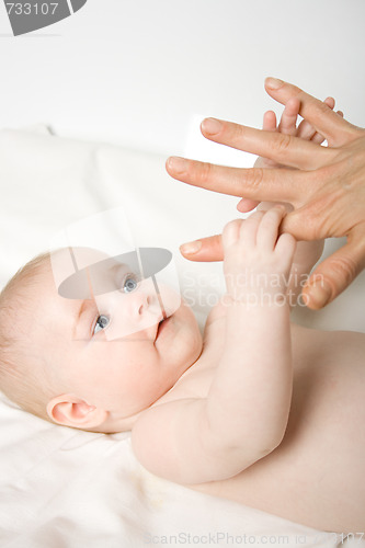 Image of Baby hold mothers hand