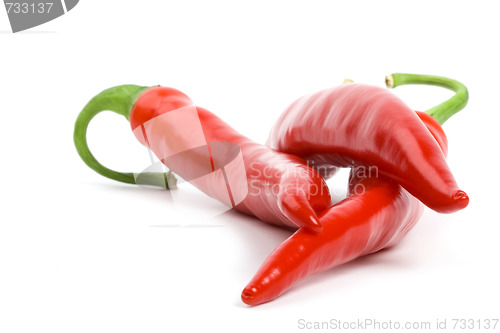 Image of three red chilly peppers