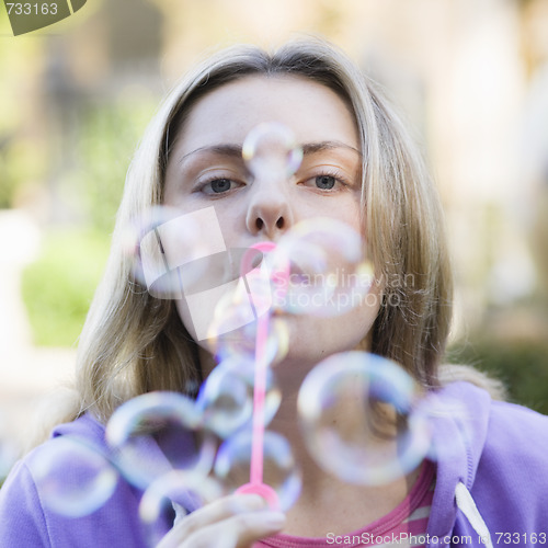 Image of Teen Girl Blowing Bubbles