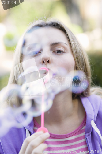 Image of Teen Girl Blowing Bubbles