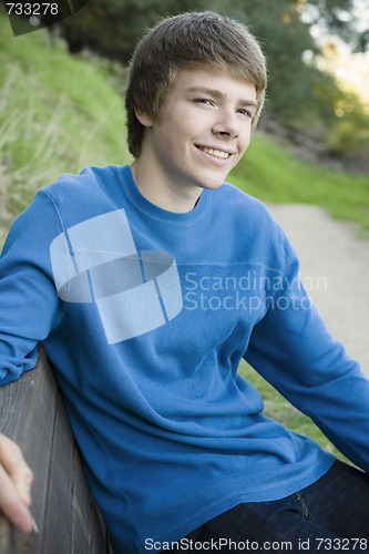 Image of Teen Boy on Park Bench