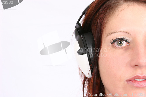 Image of Woman listening to her favorite music