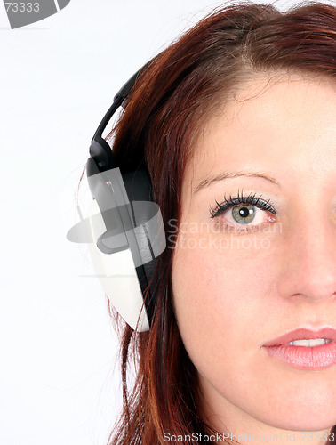 Image of Woman listening to her favorite music