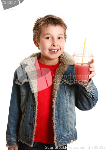 Image of Happy healthy boy holding fresh fruit juice in clear cup