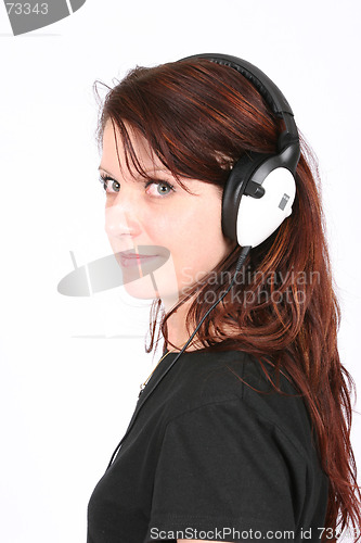 Image of Woman listening to her favorite music
