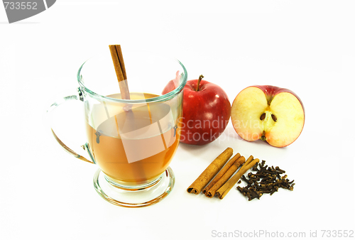 Image of Hot apple cider in glass over white. 