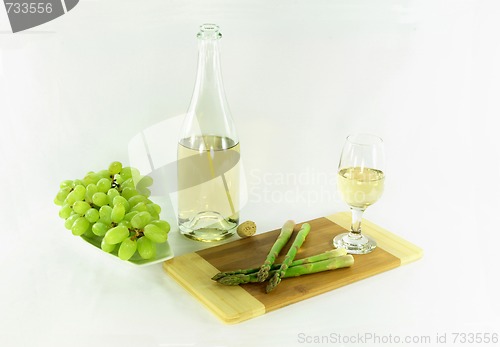 Image of White wine and sides. 