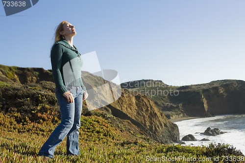 Image of Woman Standing on Cliffside