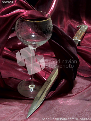 Image of wine and bayonet