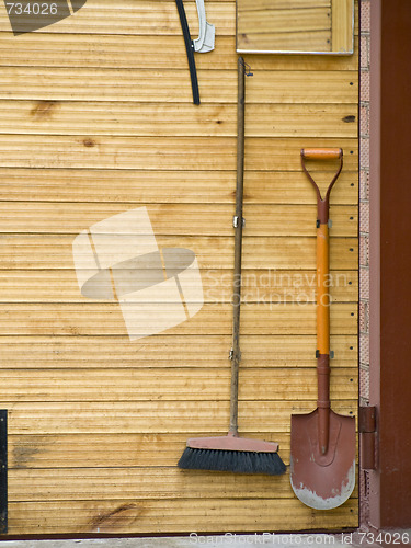 Image of shovel and broom