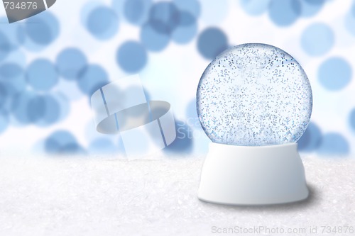 Image of Christmas Snow Globe With Blue Holiday Background