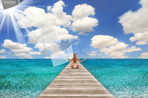 Image of Beach Scene on a Bright Day With Woman Meditating
