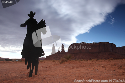 Image of Three Sisters Monument With Cowboy Silhouette