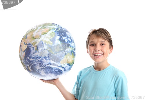 Image of Smiling boy with world in palm of his hands