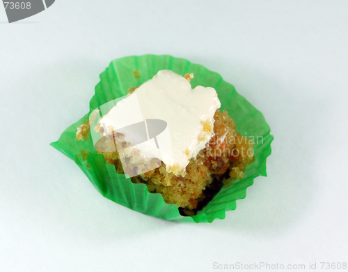 Image of a mini square carrot cake topped with white icing