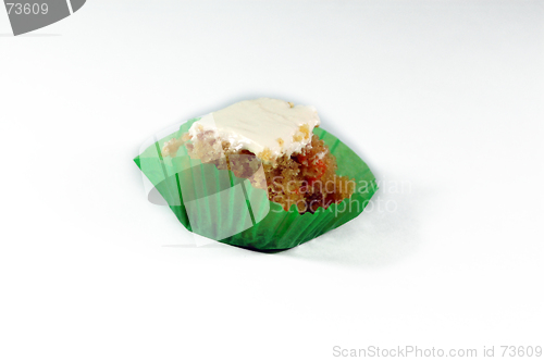 Image of a mini square carrot cake topped with white icing