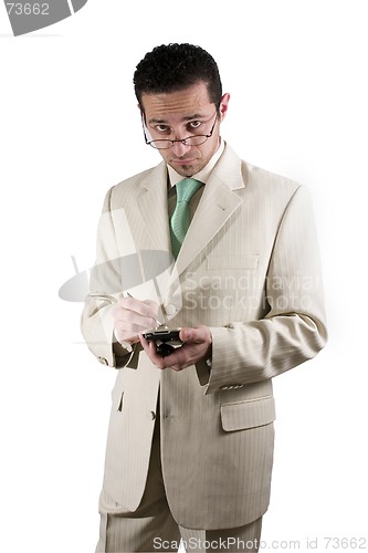 Image of Businessman with PDA looking over his glasses