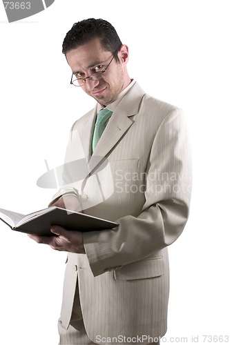 Image of Businessman with a pair of glassed reading a book