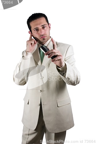 Image of Businessman on the PDA phone with an ear piece