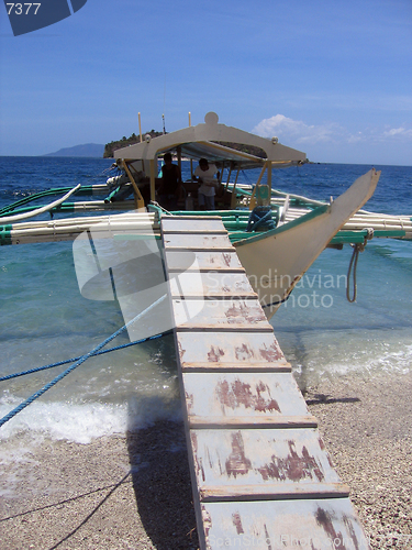 Image of boarding a banca near puerto galera mindoro philippines