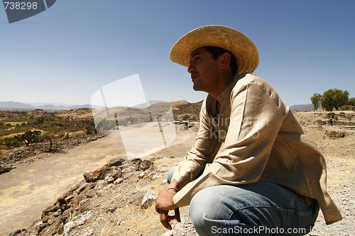 Image of Handsome man with a hat, watching over the land